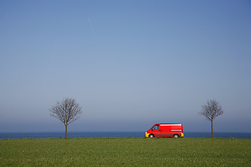 Image showing Red van in spring landscape