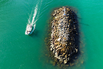 Image showing Wave breaker stone with ship