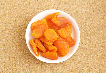 Image showing Dried apricots with toothpick