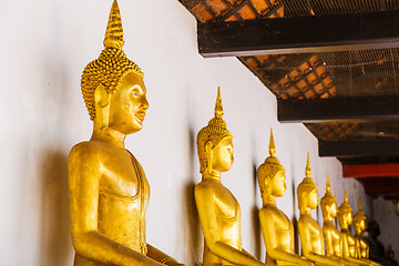 Image showing Golden Buddha in a row