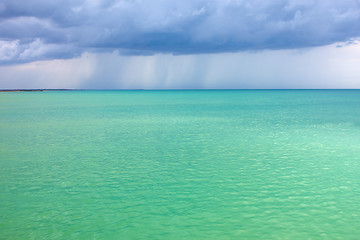 Image showing Storm clouds over the turquoise sea
