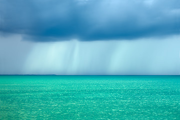 Image showing Storm rain clouds over the turquoise sea