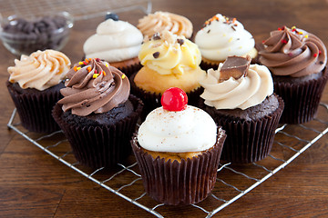 Image showing Cupcakes Iced on Cooling Rack