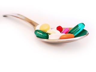 Image showing Spoon full of pills