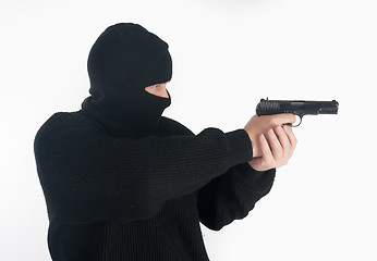 Image showing masked man aims with gun