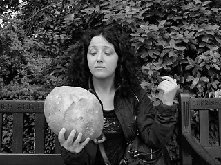 Image showing Girl eating bread