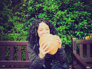 Image showing Girl eating bread