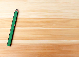 Image showing Green carpentry pencil on wood