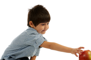 Image showing Little Boy Reaching for Apple