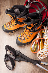 Image showing Hiking boots with trekking poles