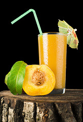 Image showing Peaches and glass with juice