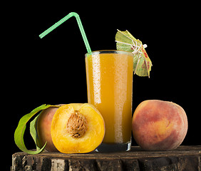 Image showing Peaches and glass with juice