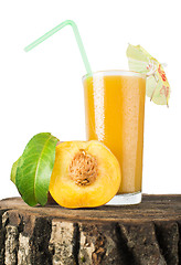 Image showing Peaches and glass with juice.