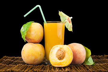 Image showing Peaches and glass with juice