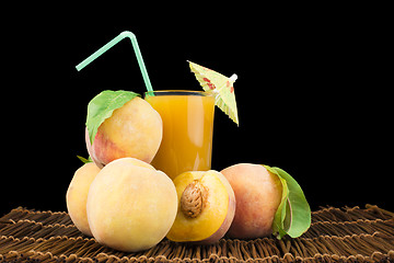 Image showing Peaches and glass with juice