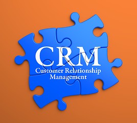 Image showing CRM on Blue Puzzle Pieces. Business Concept.