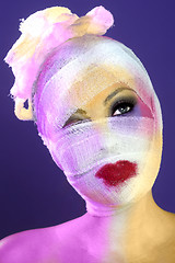 Image showing Extreme Beauty Concept of Heavy Makeup Seeping Through Gauze