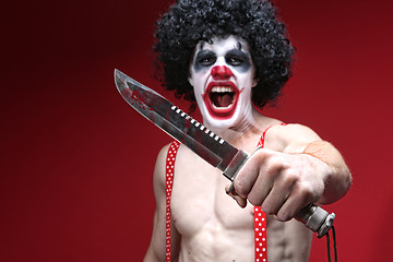 Image showing Spooky Clown Holding a Bloody Knife