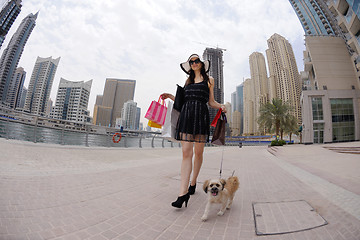 Image showing beautiful woman goes in shopping