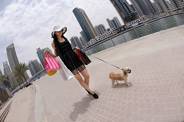 Image showing beautiful woman goes in shopping