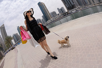 Image showing beautiful woman goes in shopping