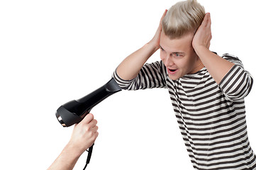 Image showing Portrait of man and hairdryer