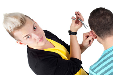 Image showing Hairdresser working with scissors