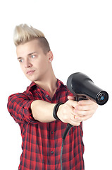 Image showing Portrait of handsome man with hairdryer on hands