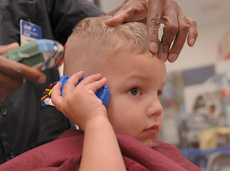 Image showing Toddler Boy Getting Haircut