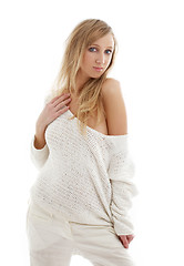 Image showing lovely blond in white linen trousers and sweater