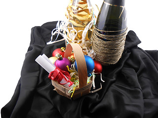 Image showing bottle of champagne, christmas balls and white invitation paper