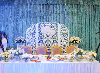 Image showing Tables decorated with flowers