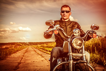 Image showing Biker on a motorcycle