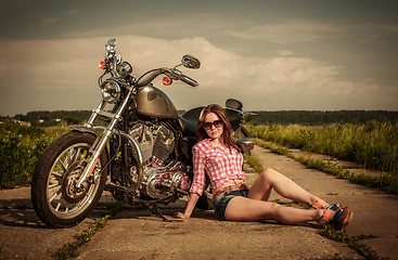 Image showing Biker girl and motorcycle