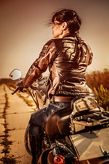 Image showing Biker girl on a motorcycle