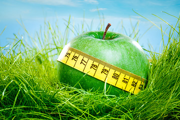 Image showing apple and measuring tape