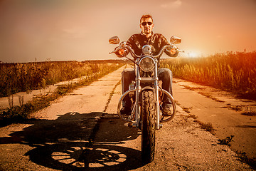 Image showing Biker on a motorcycle