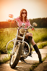 Image showing Biker girl and motorcycle