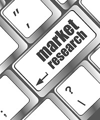 Image showing key with market research text on laptop keyboard