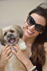 Image showing happy young woman with puppy have fun