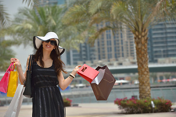 Image showing beautiful woman goes in shopping