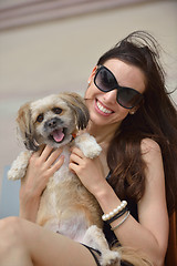 Image showing happy young woman with puppy have fun