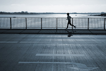 Image showing Early morning jogger.