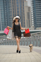 Image showing beautiful woman goes in shopping