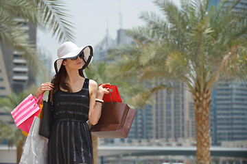 Image showing beautiful woman goes in shopping