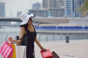 Image showing beautiful woman goes in shopping