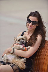 Image showing happy young woman with puppy have fun