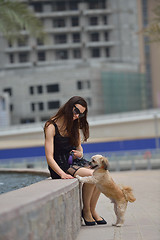 Image showing happy young woman with puppy have fun