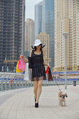 Image showing beautiful woman goes in shopping