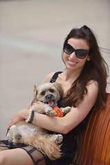 Image showing happy young woman with puppy have fun